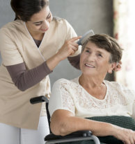 caregiver combing patients hair